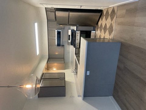 a kitchen with a refrigerator and a counter top